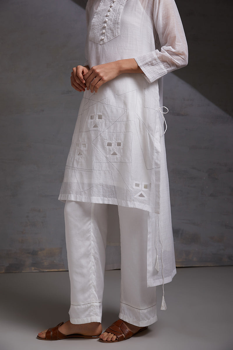woman wearing white three piece handcrafted party co ord set in silk chanderi