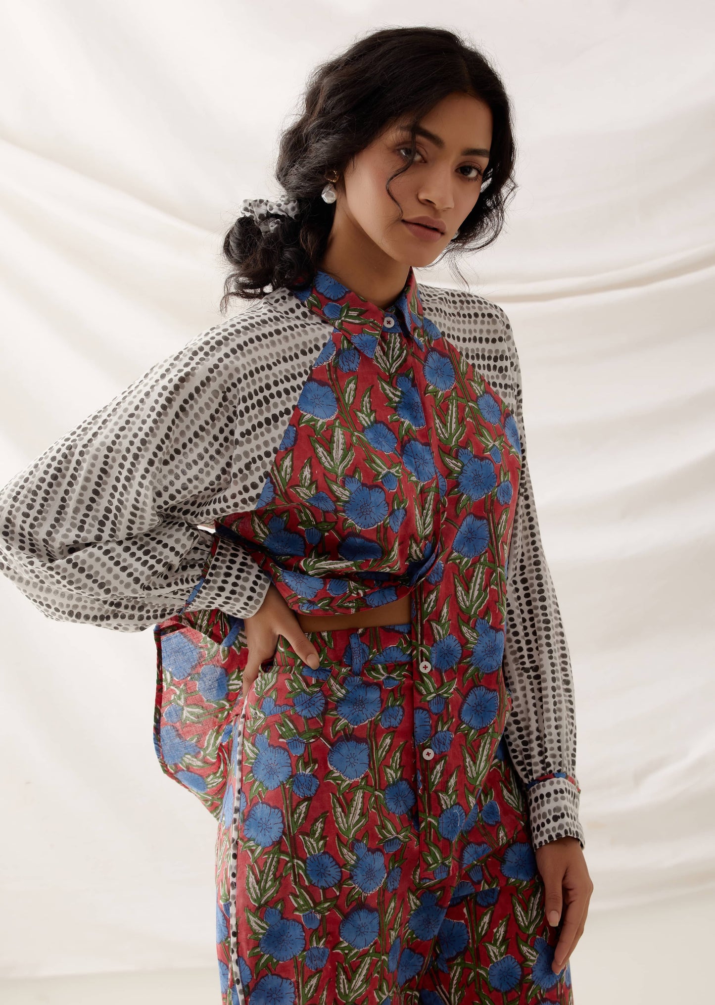 woman wearing handcrafted red floral block printed co ord set in 100% cotton.