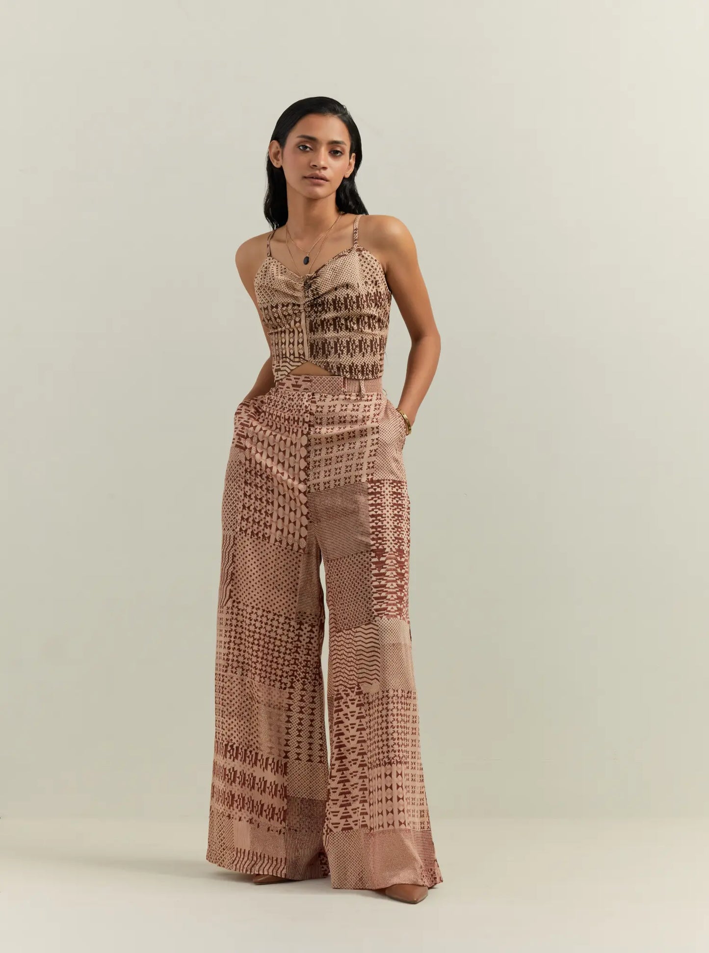 Woman wearing beige  block printed co ord set in cotton satin